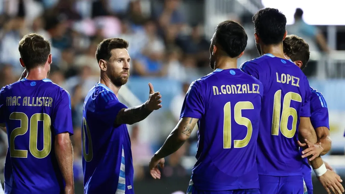 Lionel Messi celebrates Argentina’s goal with his teammates.