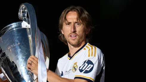Luka Modric of Real Madrid celebrates with the UEFA Champions League trophy in 2024.