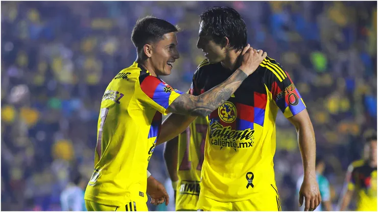 Brian Rodriguez of America celebrates with teammate