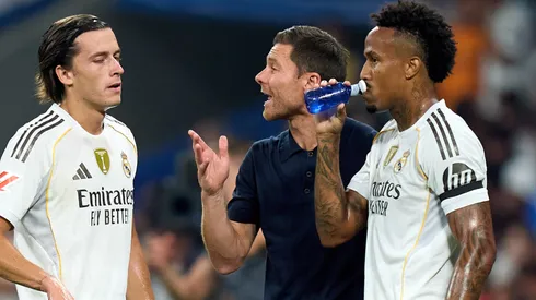 Xabi Alonso, Head Coach of Real Madrid gives instructions to Alvaro Carreras and Eder Militao.