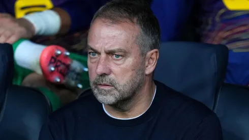 Hansi Flick, Head Coach of FC Barcelona, looks on from the bench.
