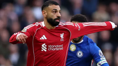Mohamed Salah of Liverpool holds off.