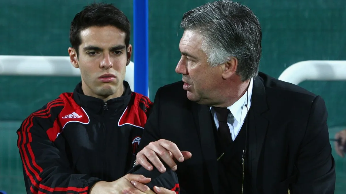 Kaka (L) speaks with Carlo Ancelotti (R), manager of AC Milan.