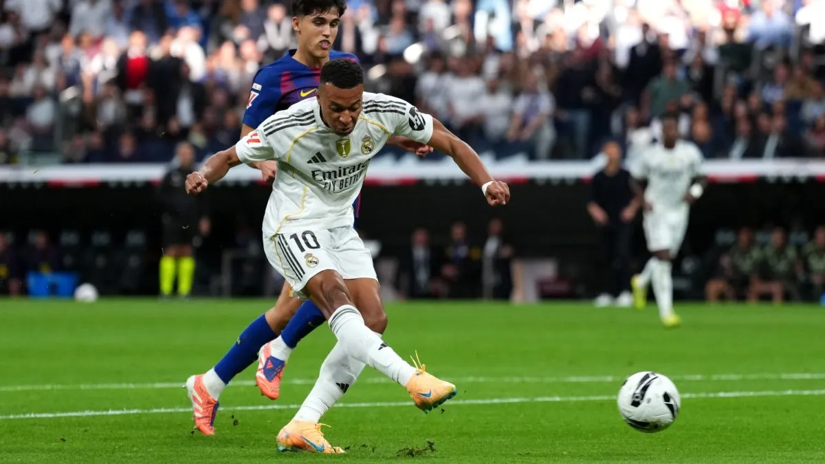 Real Madrid star Kylian Mbappe  scoring a goal