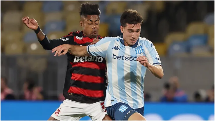Facundo Mura of Racing Club is challenged by Bruno Henrique of Flamengo