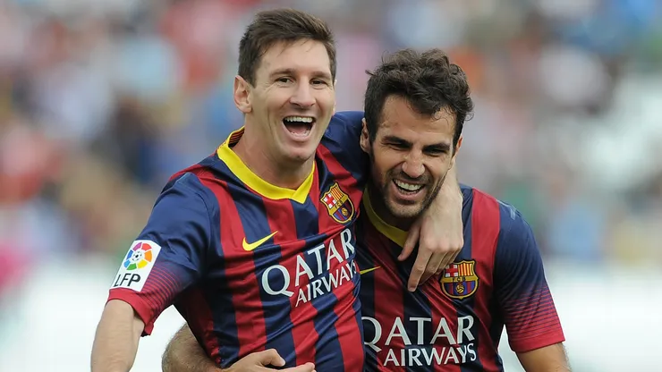 Lionel Messi and Cesc Fabregas playing for Barcelona.