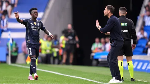 Vinicius Junior interacts with Xabi Alonso, Head Coach of Real Madrid.