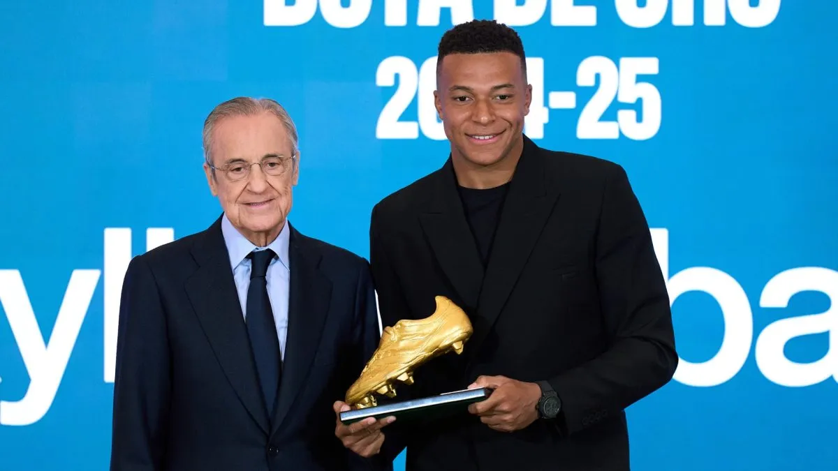 Kylian Mbappe poses the Golden Boot trophy and Florentino Perez, president of Real Madrid.