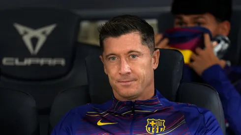 Robert Lewandowski of FC Barcelona looks on from the bench.