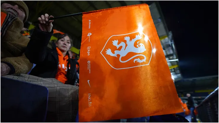 A Team Netherlands fan holds a flag