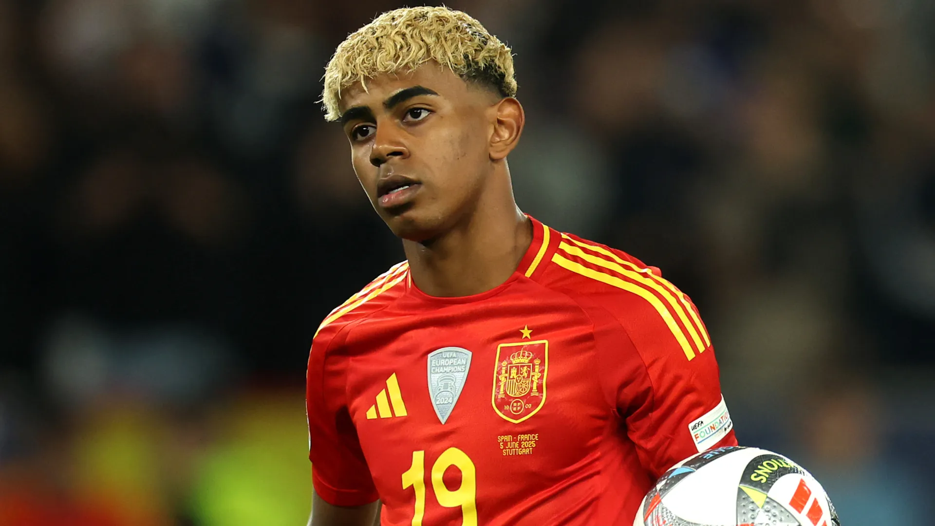 Spain star Lamine Yamal looking on