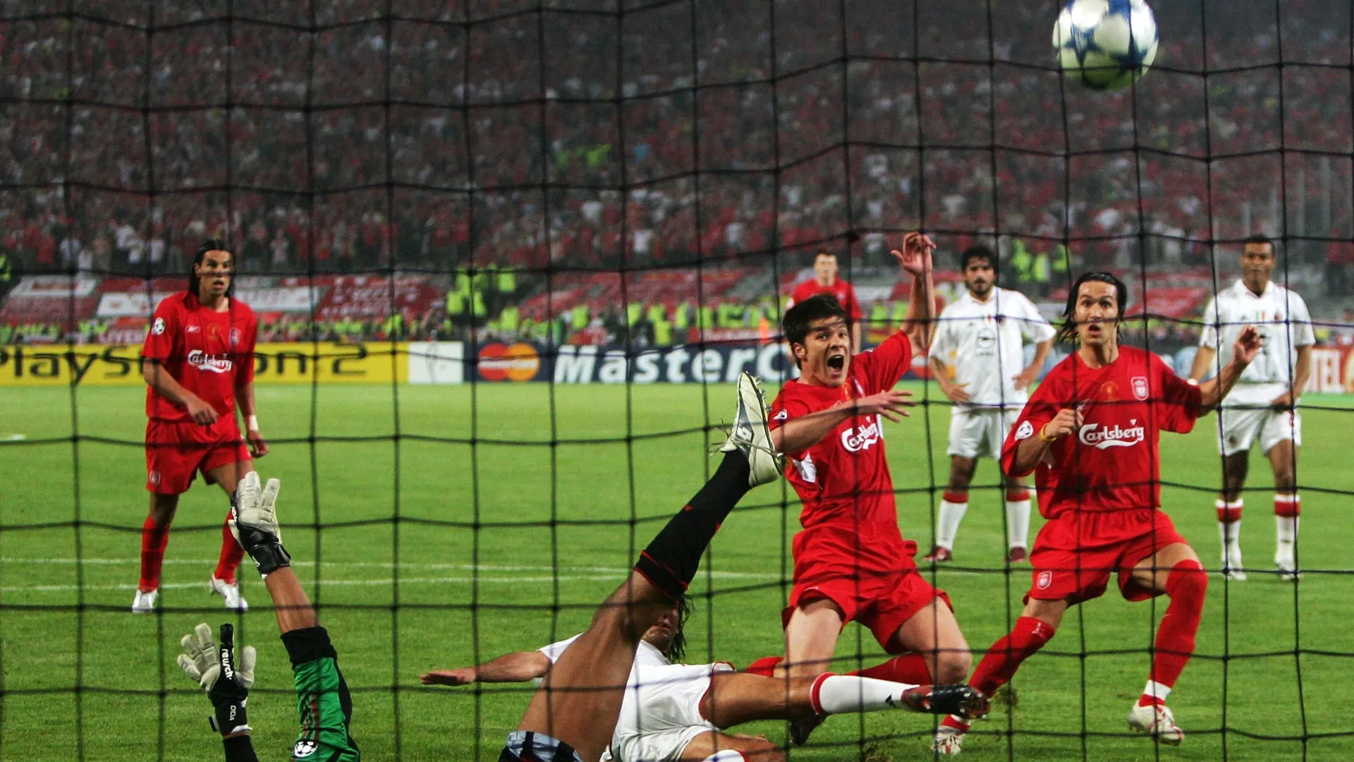 Liverpool's Xabi Alonso scores the third goal after missing from the penalty spot.