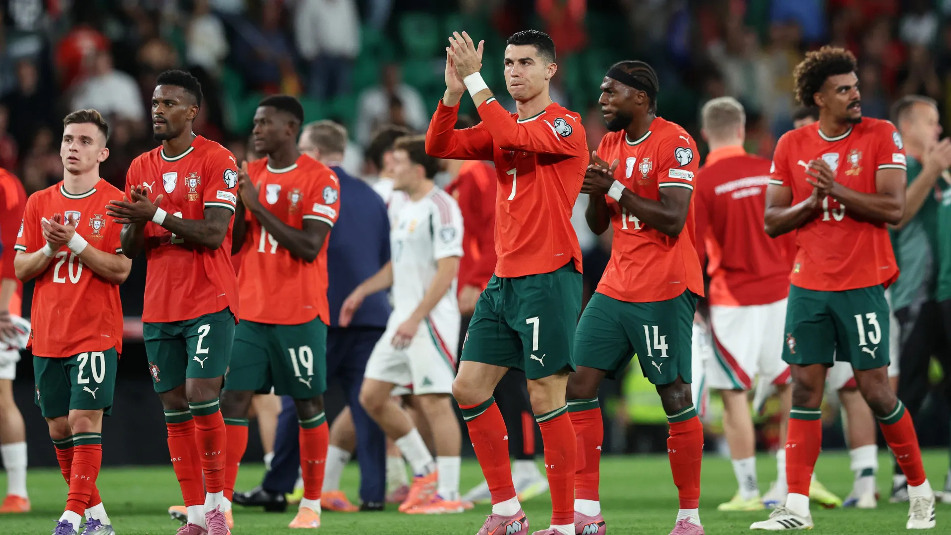 Portugal players applauding fans.