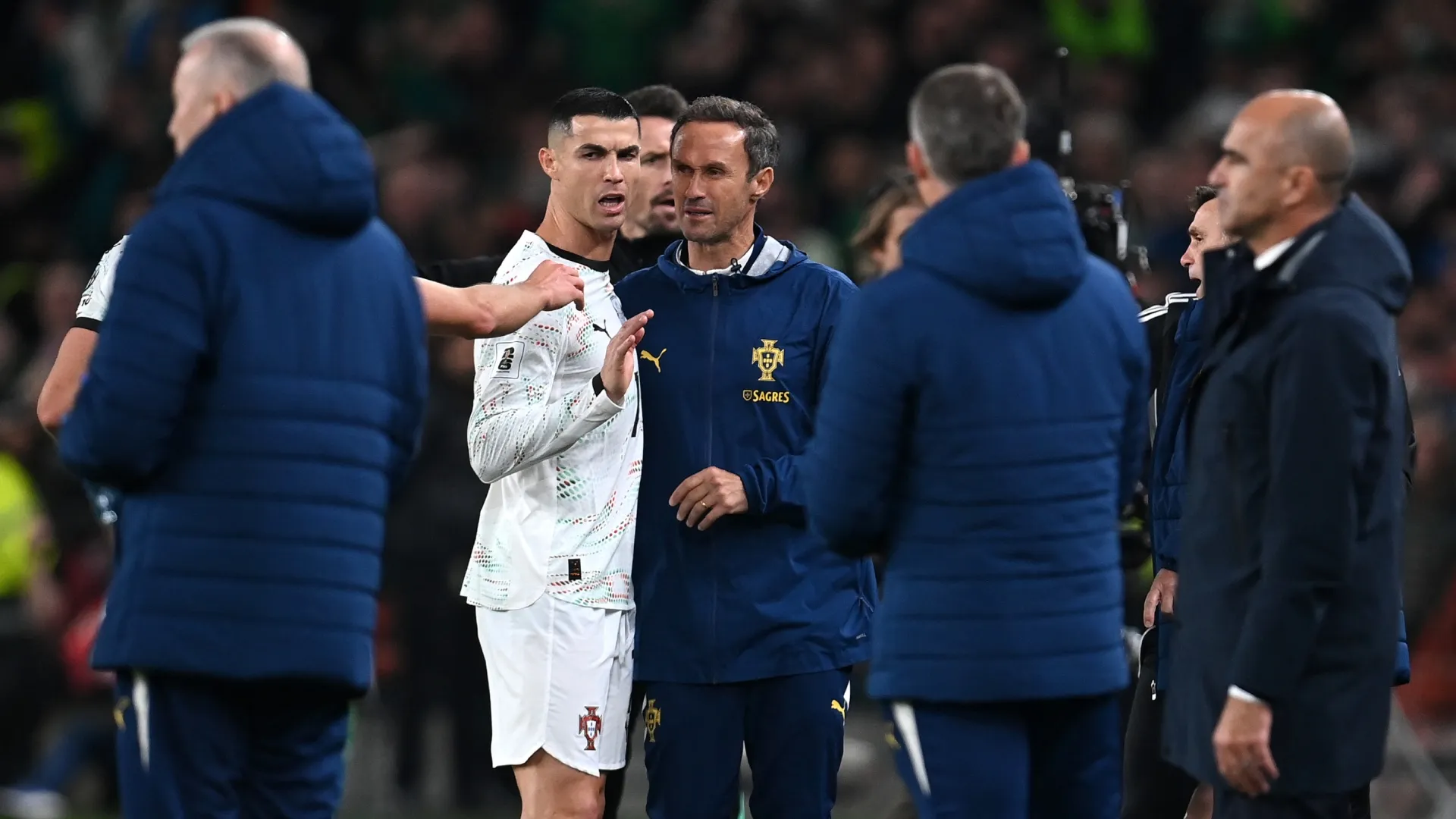 Cristiano Ronaldo of Portugal reacts after being shown a red card following VAR review.