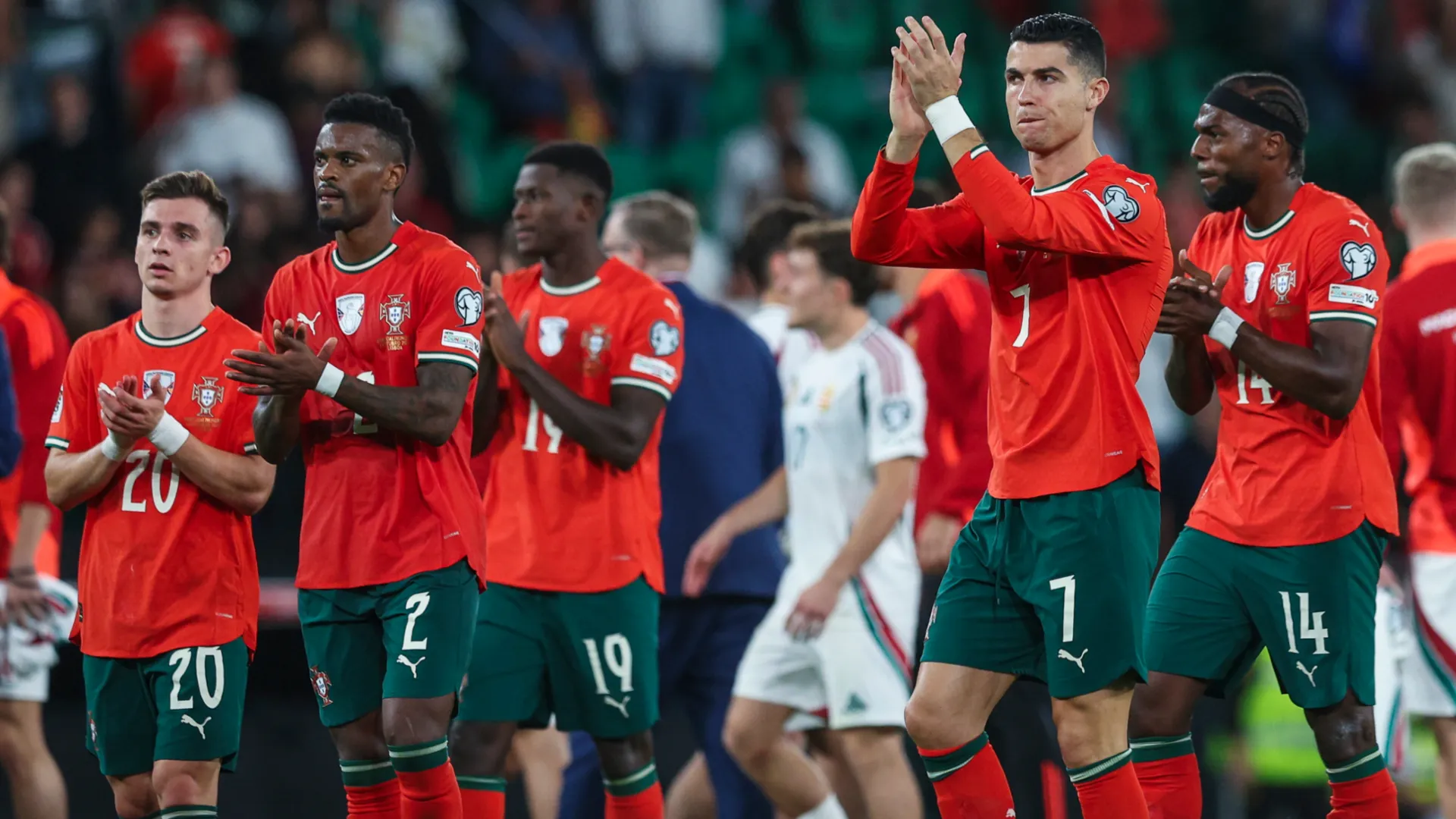 Portugal players applauding fans.
