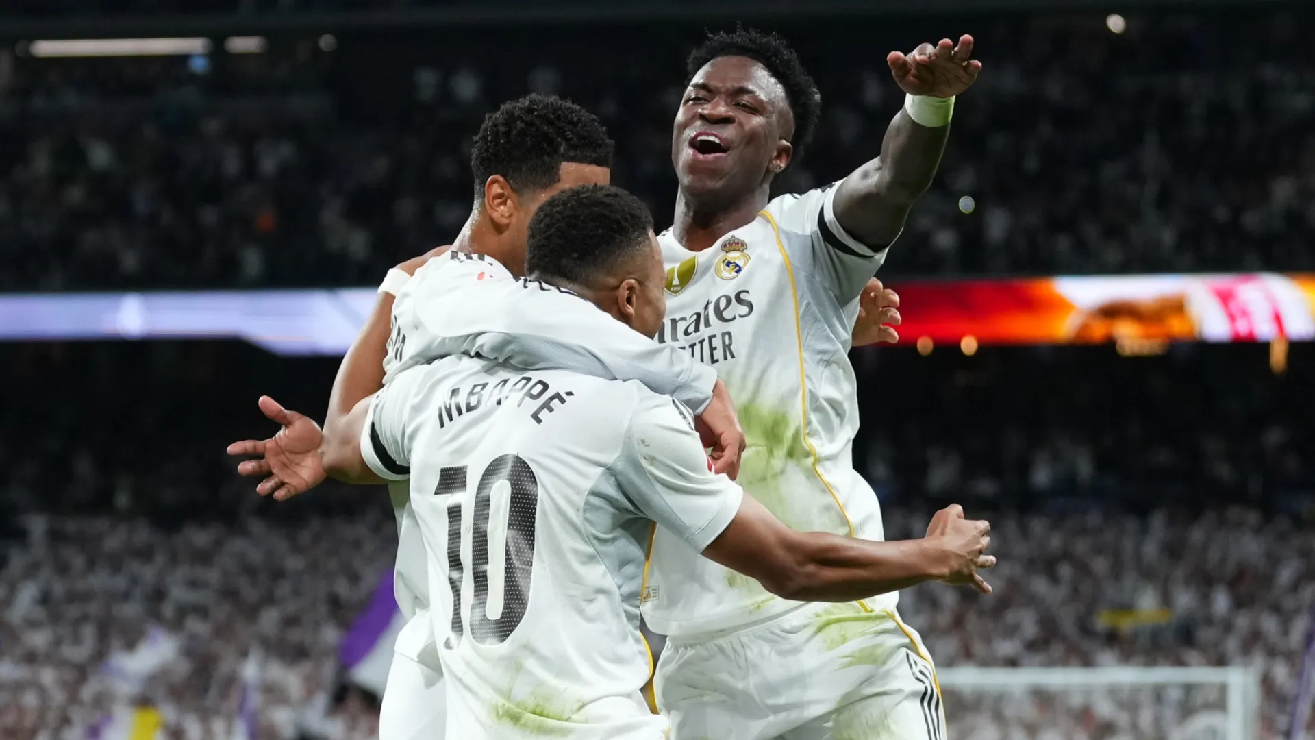 Kylian Mbappe celebrates with Jude Bellingham and Vinicius Junior.