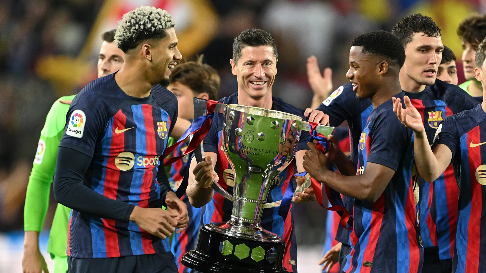 Robert Lewandowski of FC Barcelona celebrate with the La Liga trophy.