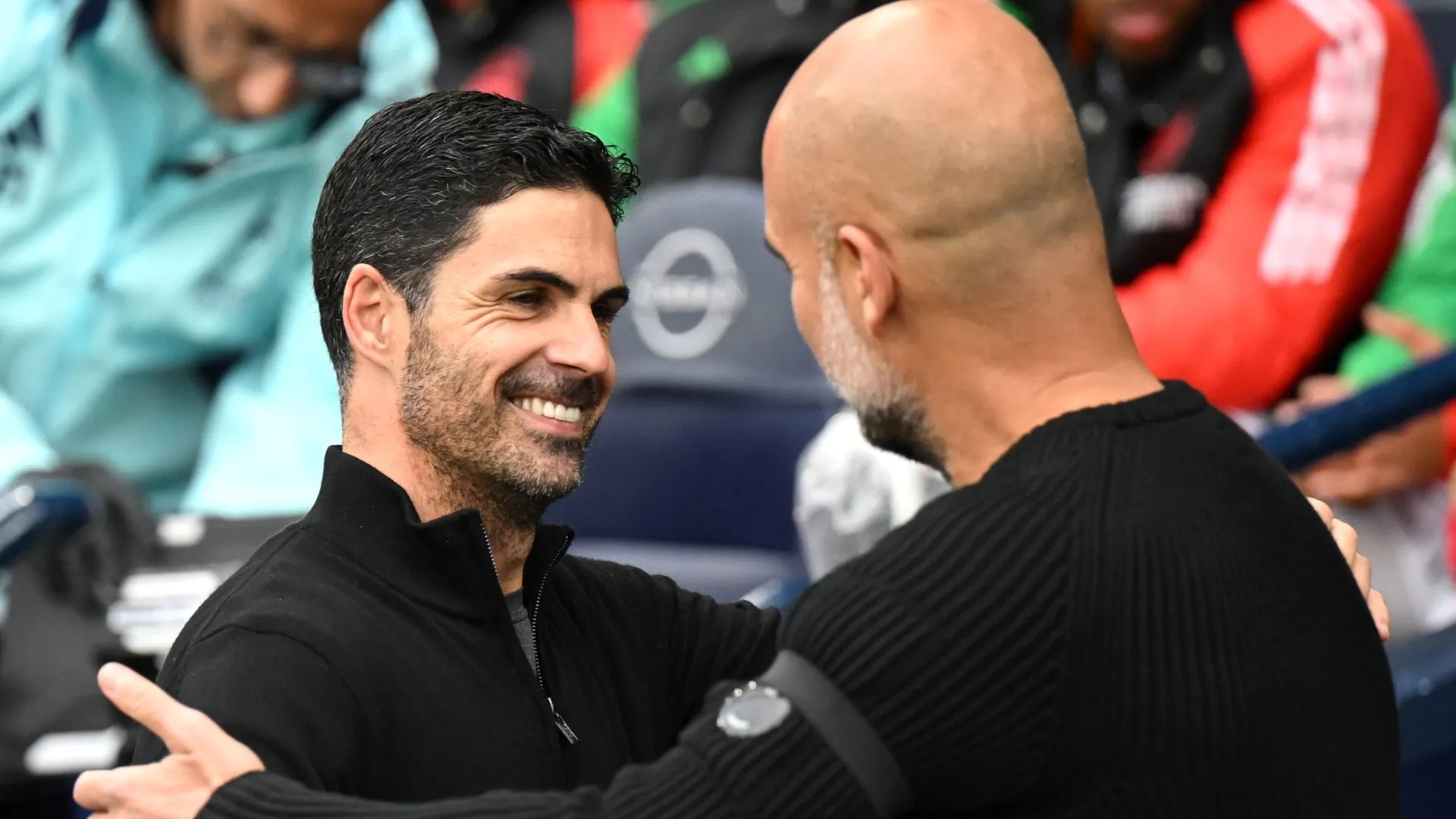Arsenal's Mikel Arteta hugging Manchester City's Pep Guardiola