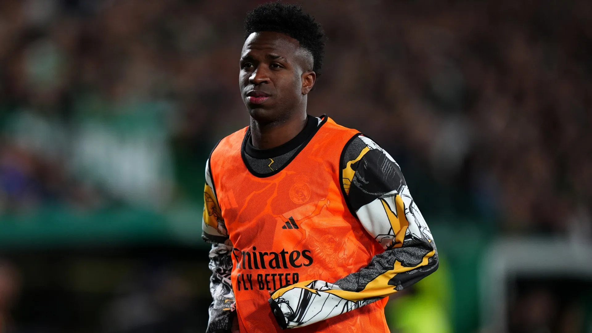 Vinicius Junior of Real Madrid warms up on the sidelines during Elche game.