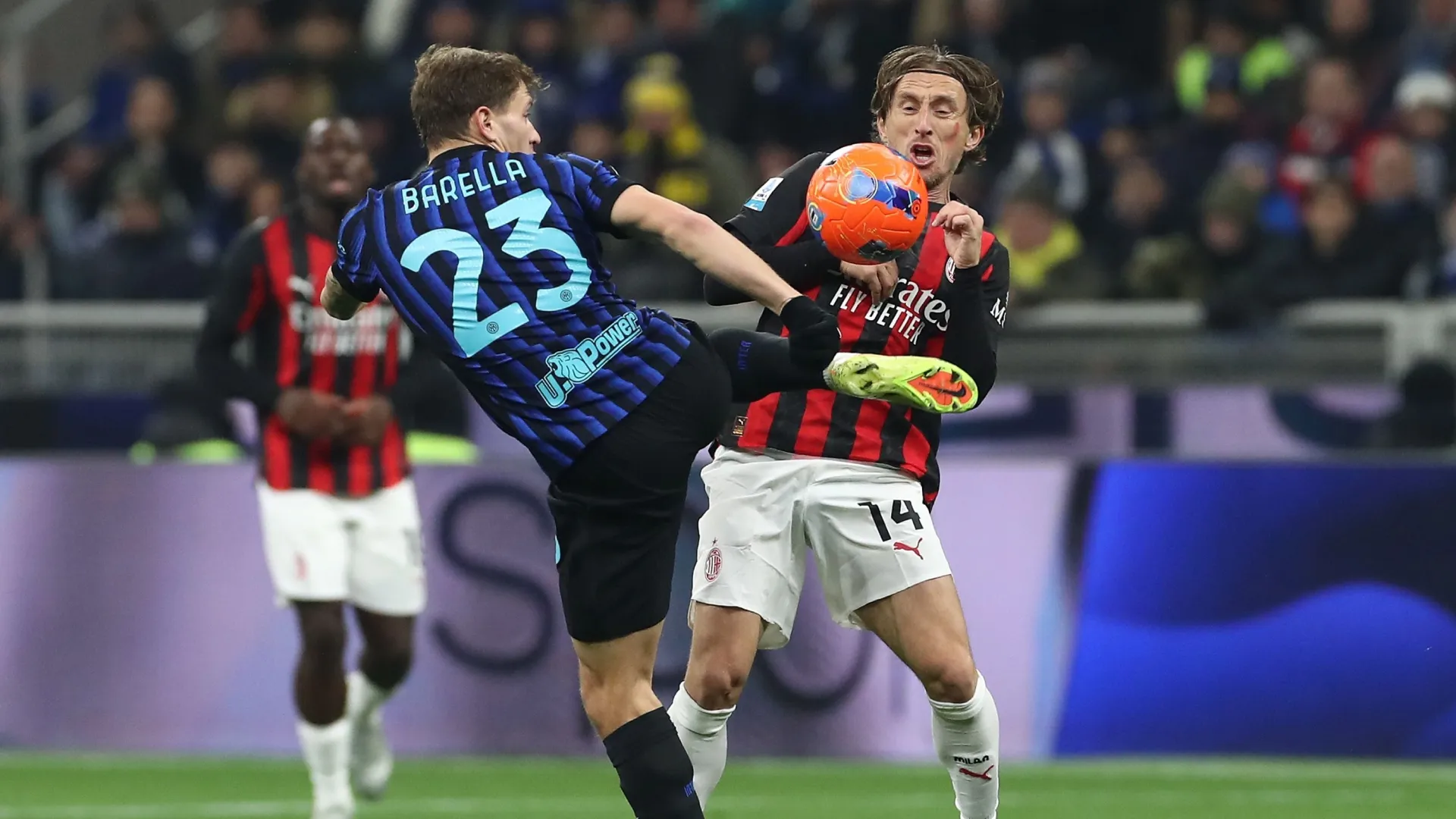 Luka Modric of AC Milan competes for the ball with Nicolo’ Barella of FC Internazionale.