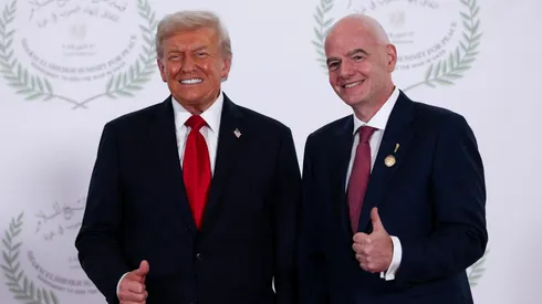 U.S. President Donald Trump and FIFA president Gianni Infantino pose for a photo at a world leaders' summit.