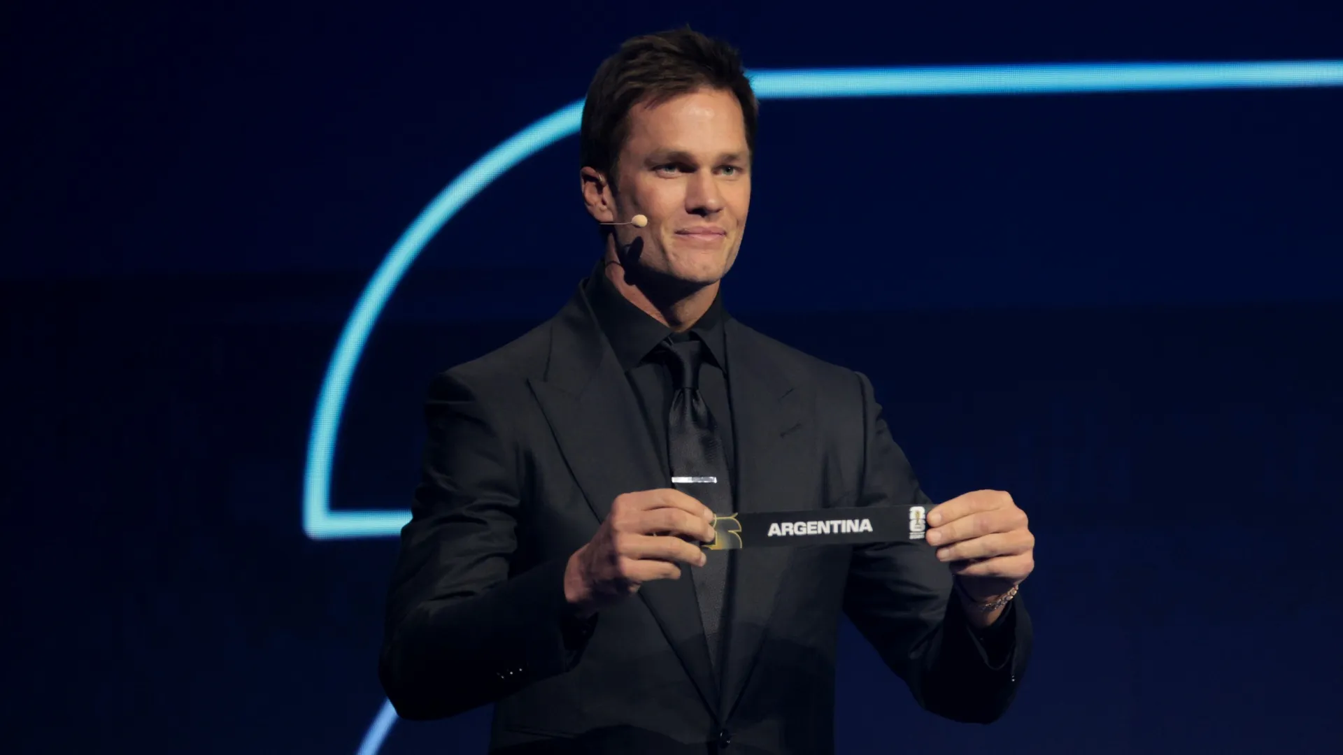 Draw assistant Tom Brady draws out the card of Argentina during the FIFA World Cup 2026 Official Draw.