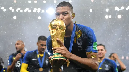 Kylian Mbappe of France celebrates with the World Cup trophy following the 2018 FIFA World Cup Final