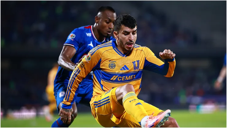 Angel Correa of Tigres competes for the ball against Willer Ditta of Cruz Azul