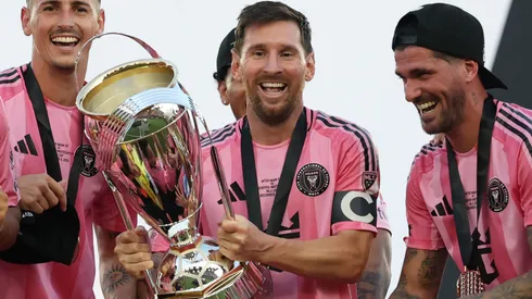 Lionel Messi #10 of Inter Miami CF lifts the Champion's trophy