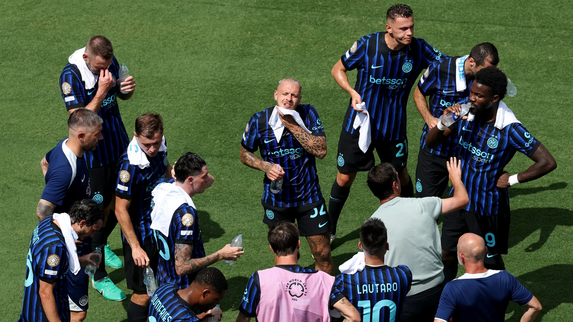 Federico Dimarco #32 of FC Internazionale Milano wipes his head with a towel during a cooling break in the FIFA Club World Cup 2025.