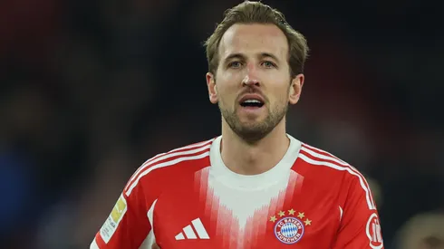 Harry Kane of Bayern Munich carries the match ball after the Bundesliga match.