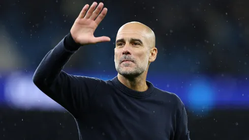 Pep Guardiola, Manager of Manchester City, waves to the fans.