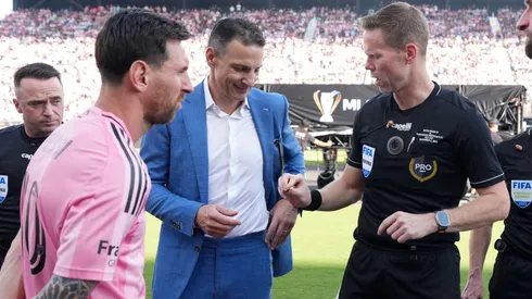 Referee Drew Fischer performs the coin toss with Captains Lionel Messi #10 of Inter Miami CF