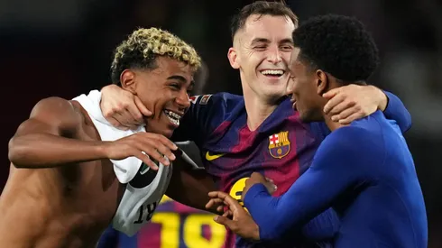 Lamine Yamal, Marc Casado and Alejandro Balde of FC Barcelona celebrate a victory.