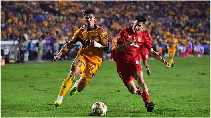 Romulo Zwarg of Tigres battles for possession against Franco Romero of Toluca