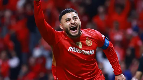 Alexis Vega of Toluca celebrates after scoring the winning penalty.