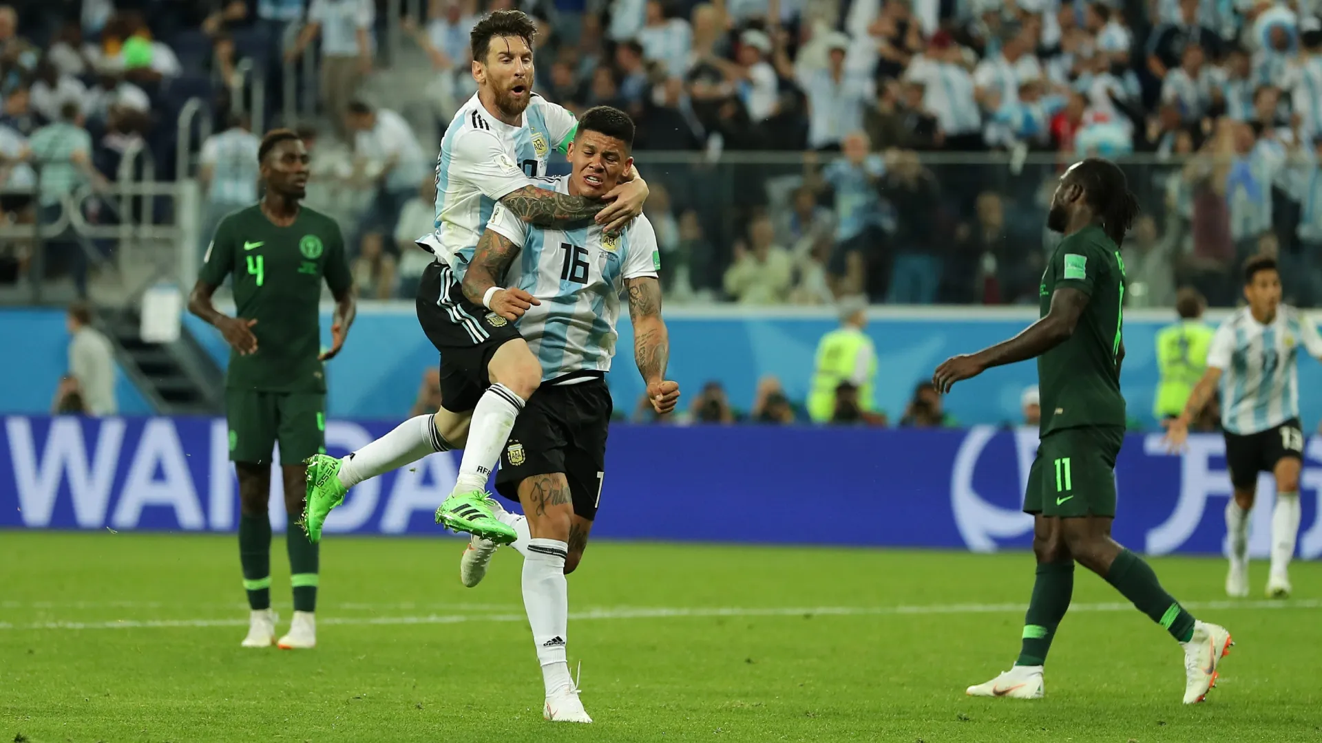 Marcos Rojo celebrates with Lionel Messi after scoring a crucial goal for Argentina against Nigeria during the 2018 FIFA World Cup.