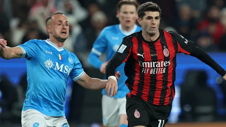 Christian Pulisic of AC Milan battles for possession with Stanislav Lobotka of SSC Napoli