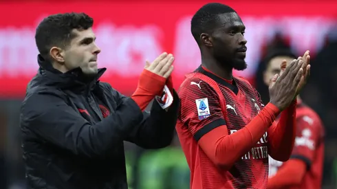 Fikayo Tomori (R) and Christian Pulisic (L) of AC Milan applaud the fans