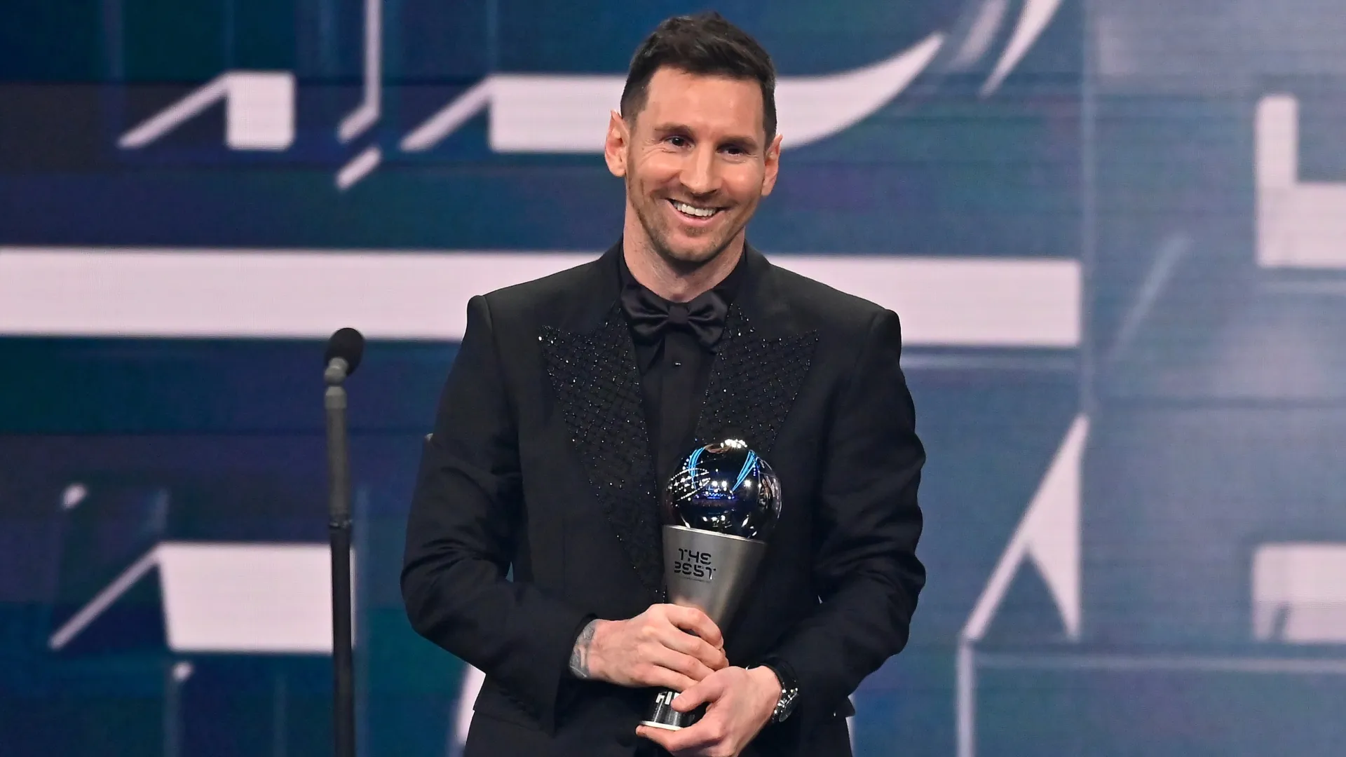 Lionel Messi poses with the Best FIFA Men's Player 2022 award.