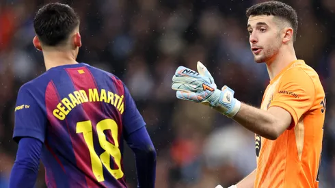 Joan Garcia and Gerard Martin of FC Barcelona interact