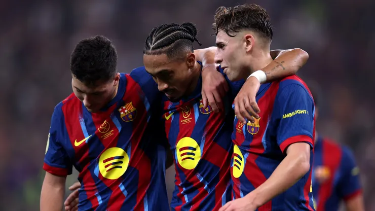 Raphinha of FC Barcelona celebrating with Fermin Lopez and Roony Bardghji.