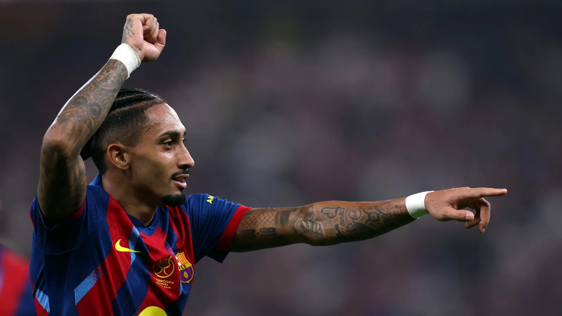 Raphinha of FC Barcelona celebrating.