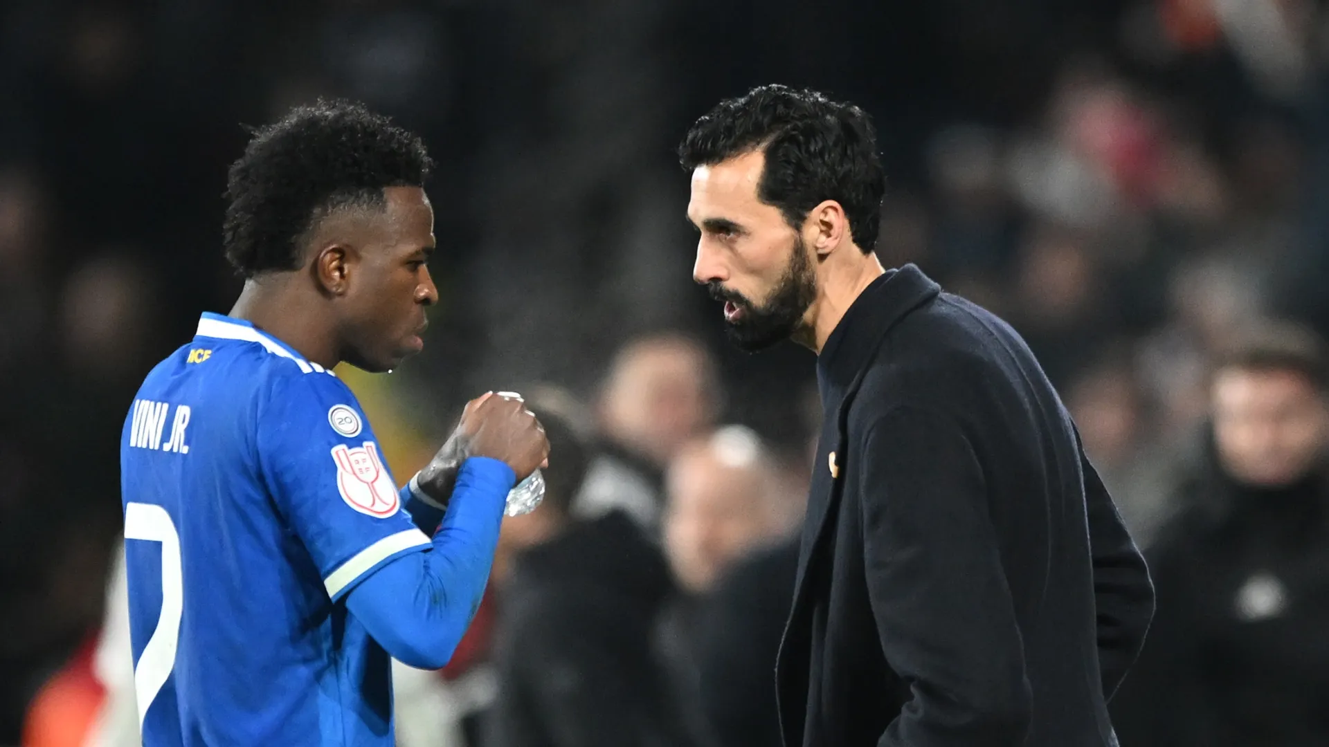 Alvaro Arbeloa, Head Coach of Real Madrid, speaks with Vinicius Junior during the game against Albacete.