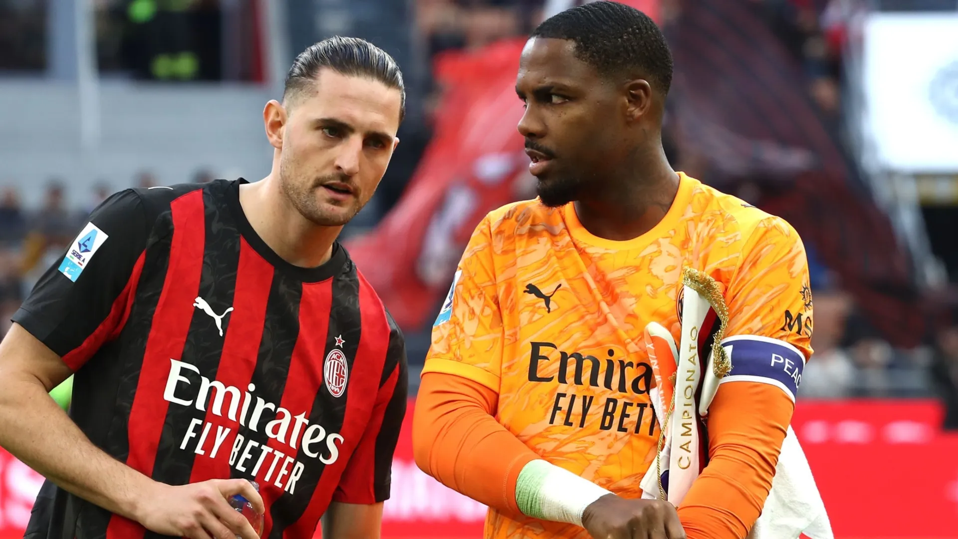 AC Milan's Adrien Rabiot and Mike Maignan