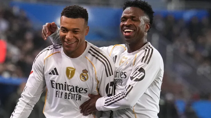 Kylian Mbappe of Real Madrid celebrates scoring his team's first goal with teammate Vinicius Junior.
