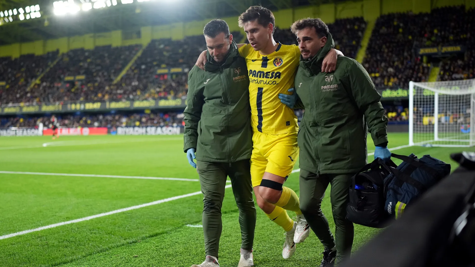 Juan Foyth of Villarreal CF is supported by medical staff as he’s substituted off the pitch due to an injury.