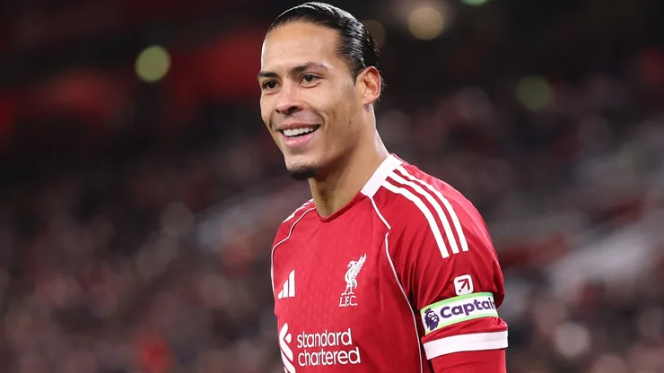 Liverpool captain Virgil van Dijk smiles during the Premier League match.
