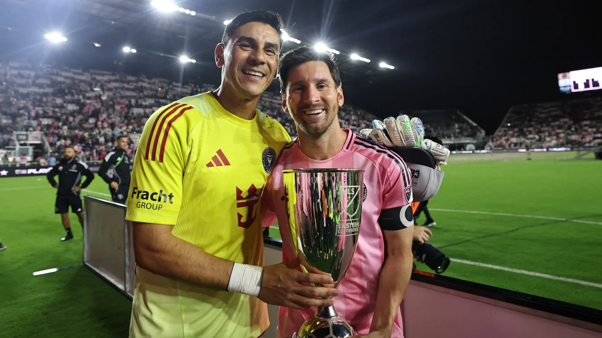 Óscar Ustari #19 and Lionel Messi #10 of Inter Miami CF celebrate with the Eastern Conference MLS Cup.