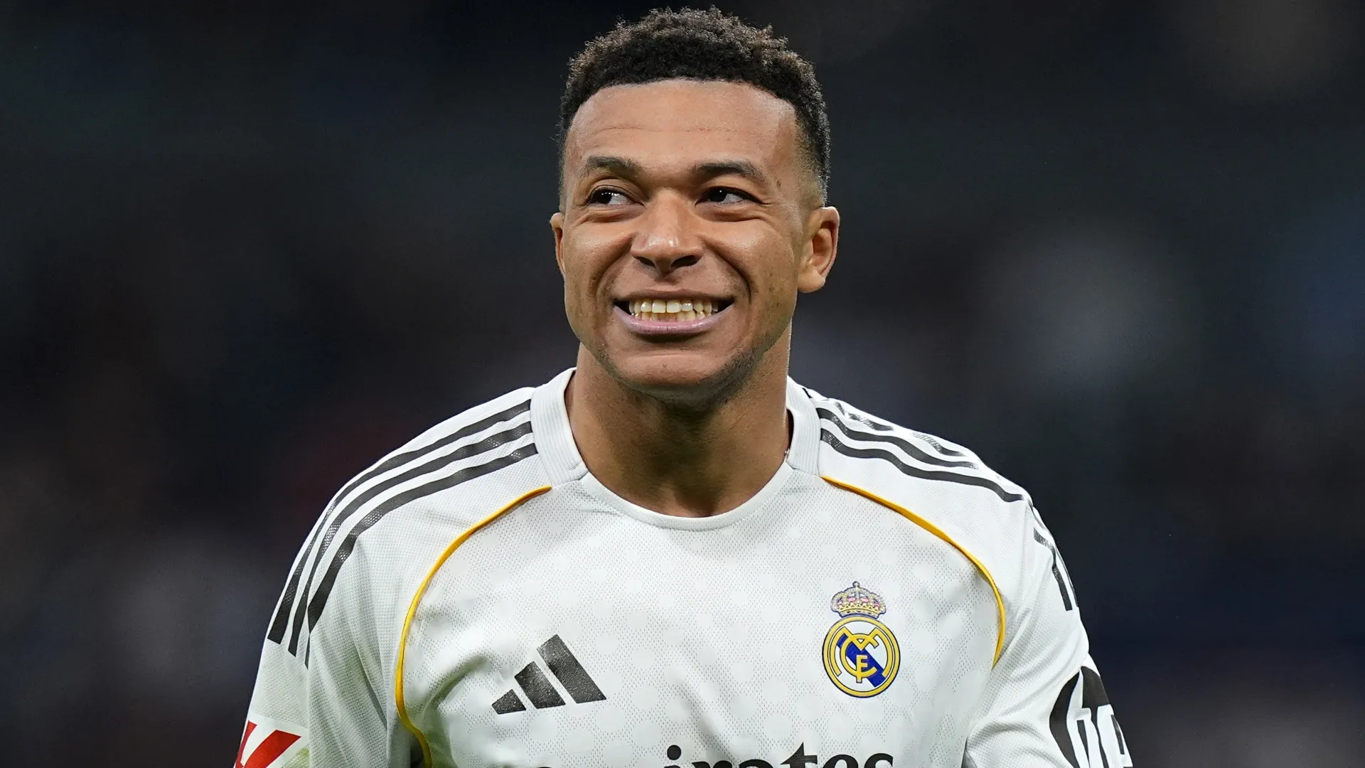Real Madrid star Kylian Mbappe smiling